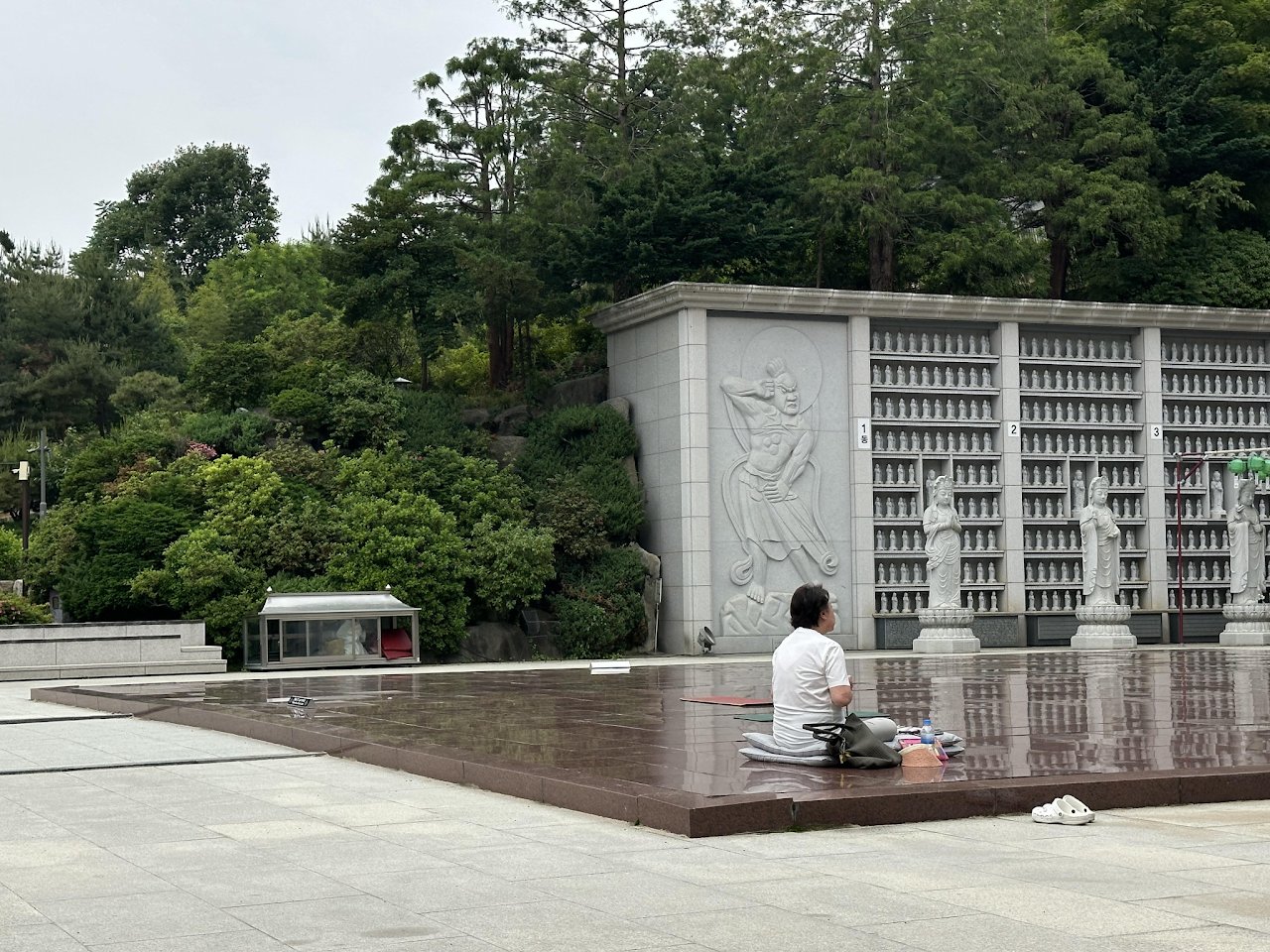 A person praying at a Buddhist temple